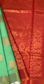 VSKC322 - rexona green color body , pinkish orange color pallu , blouse.