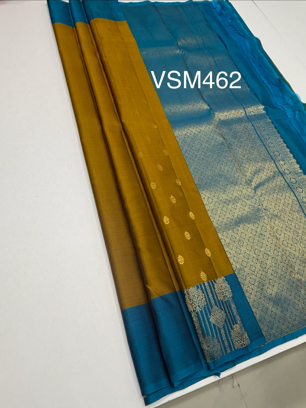 VSM462 - mehandi color body, peacock blue color pallu , blouse.