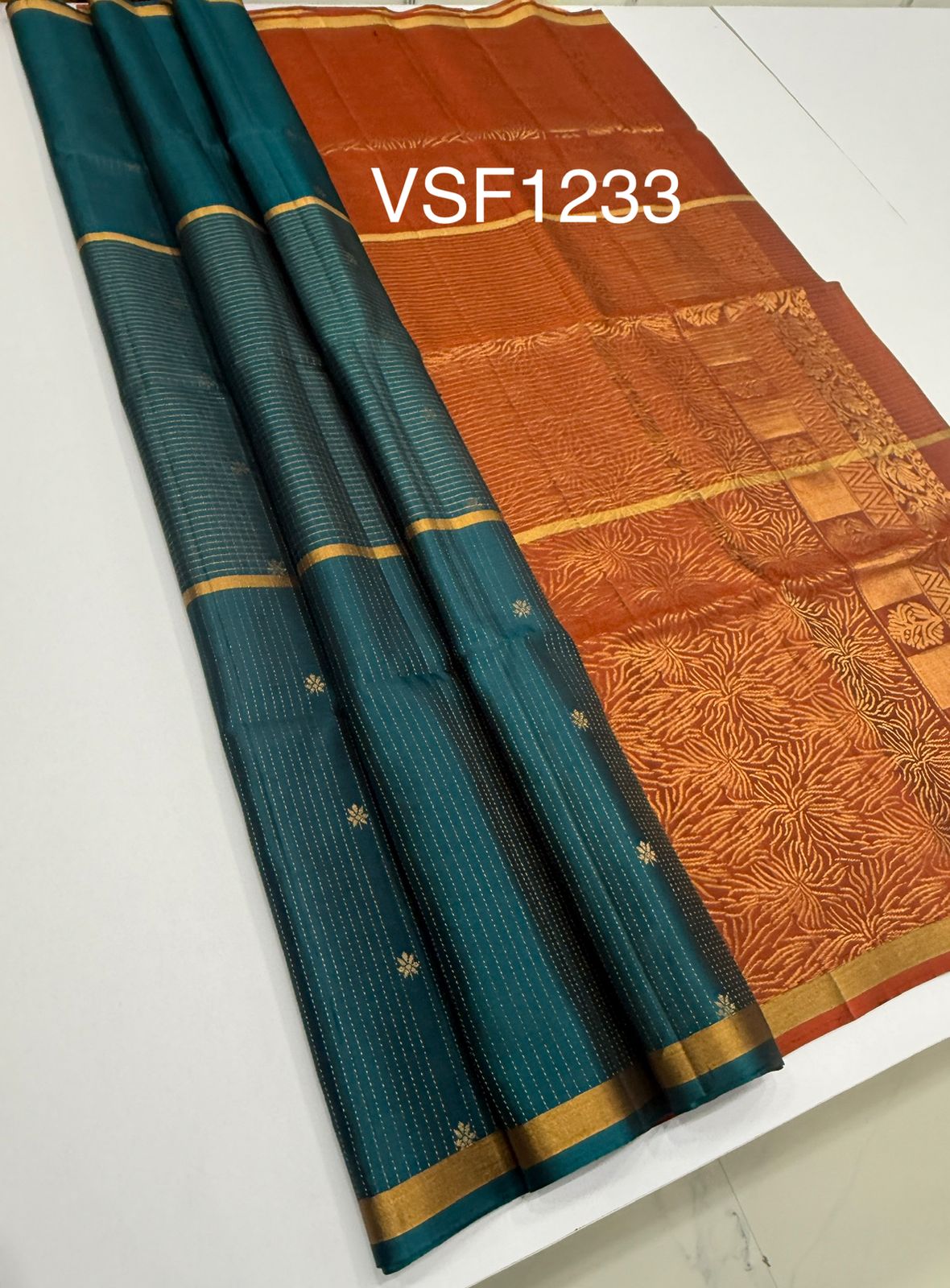 VSF1233 - peacock green color body , rust orange color pallu,blouse - Pure silk saree