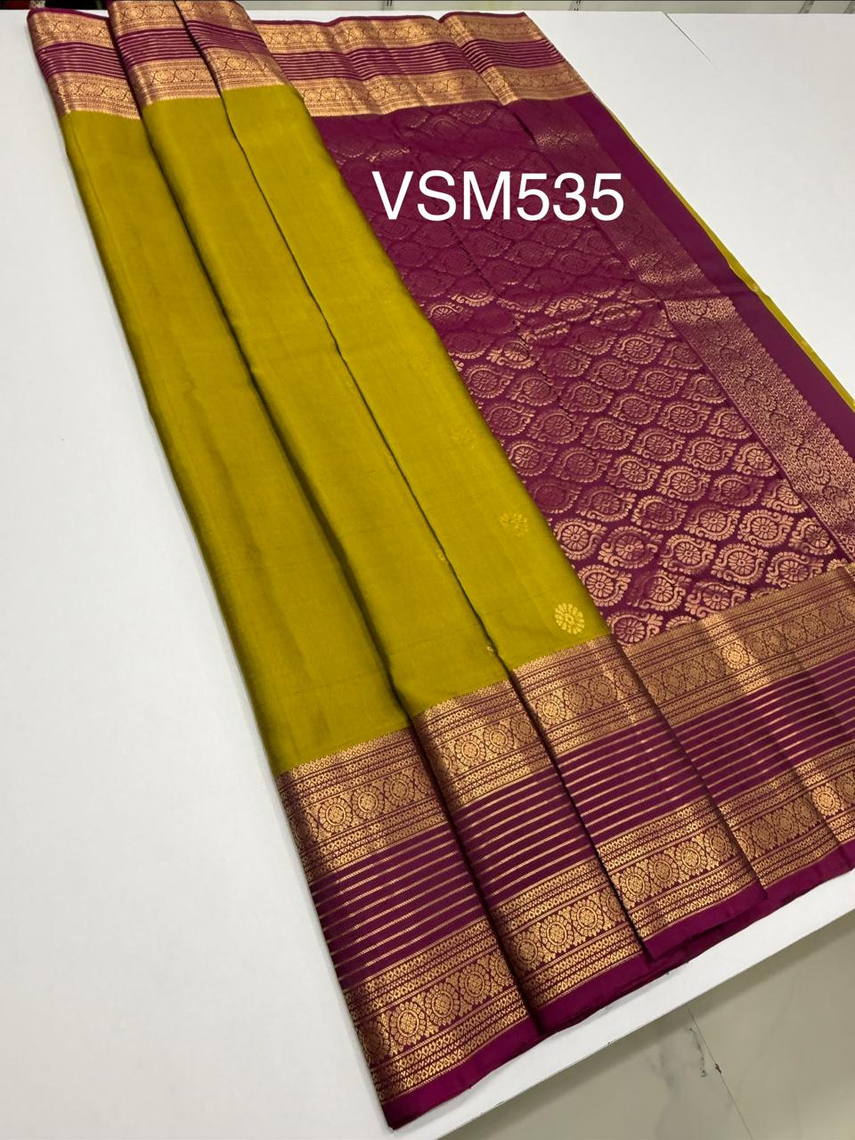 VSM535 - yellowish green color body , purple color pallu , blouse.